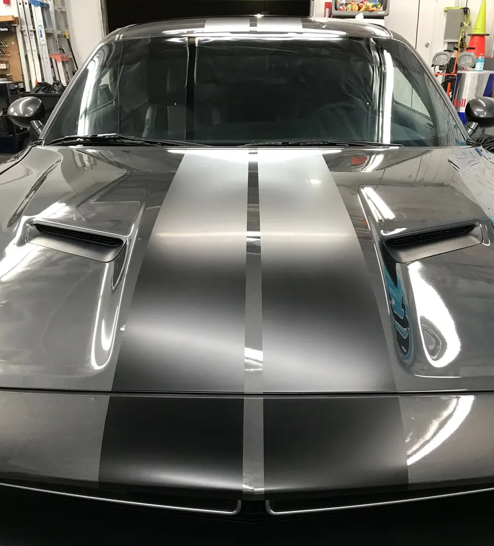 Twin centre stripes laid over silver, running hood to roof.