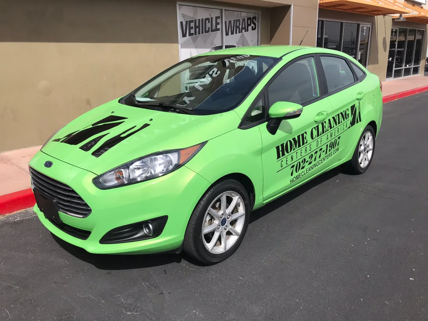 Sedan taken to a bright green colour change, then lettered on top with service copy and a number.