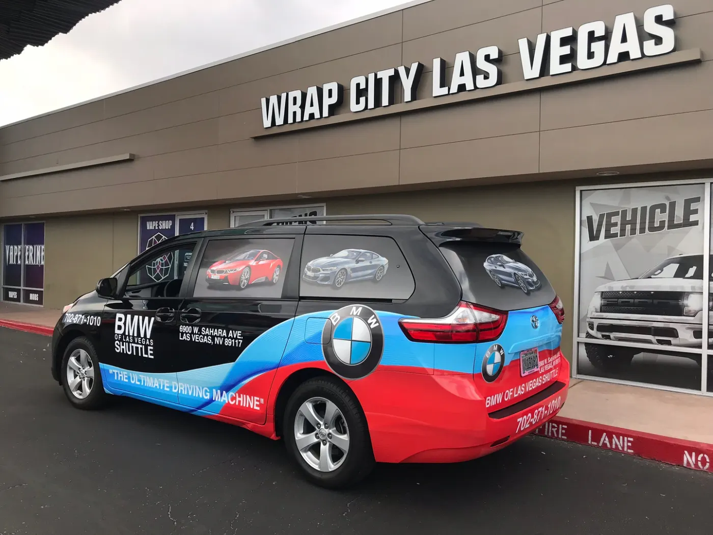 Shuttle hatchback wrapped in printed vehicle photography, roof spoiler and glass included.