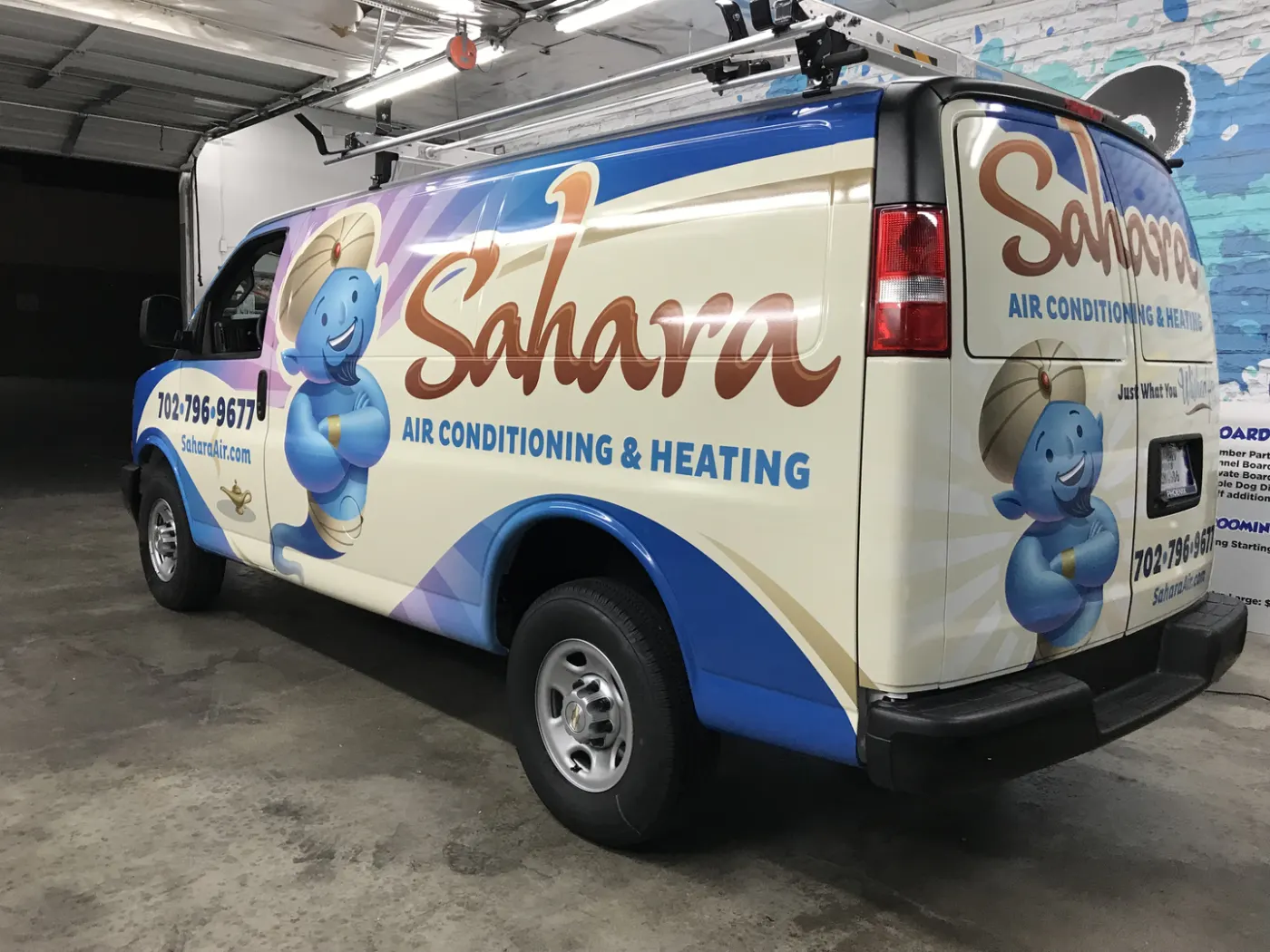 Service van wrapped in full colour with an illustrated mascot repeated front, side and rear.